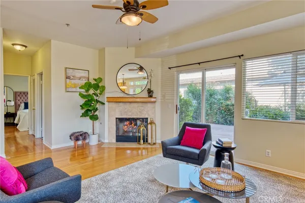 a living room with furniture and a fireplace