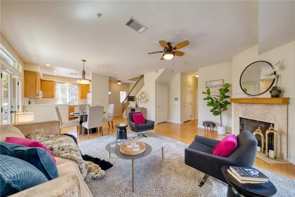 a living room with furniture fireplace and a fireplace