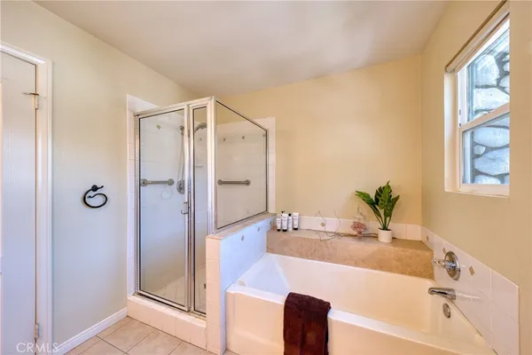 a bathroom with a bathtub and a shower
