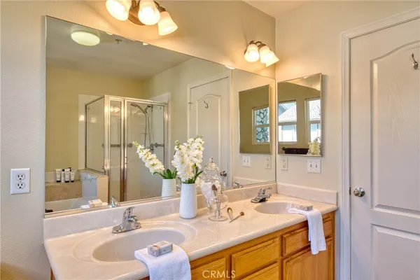a bathroom with a sink double vanity and a mirror