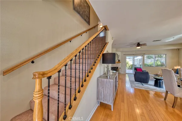 a view of entryway livingroom and hall with wooden floor