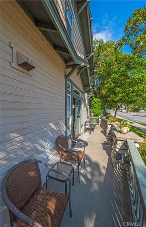 a view of backyard of house with seating space