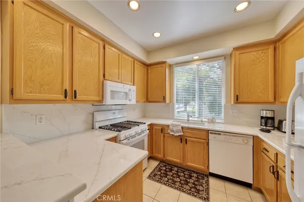 a kitchen that has a sink and a stove in it