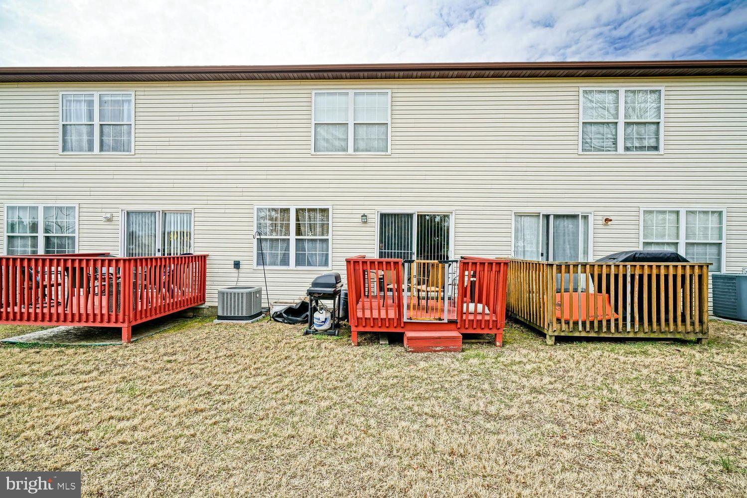 34531 Oakley Court, Unit 27 Lewes, DE 19958 - Photo 25 of 25 front view of a house with a yard