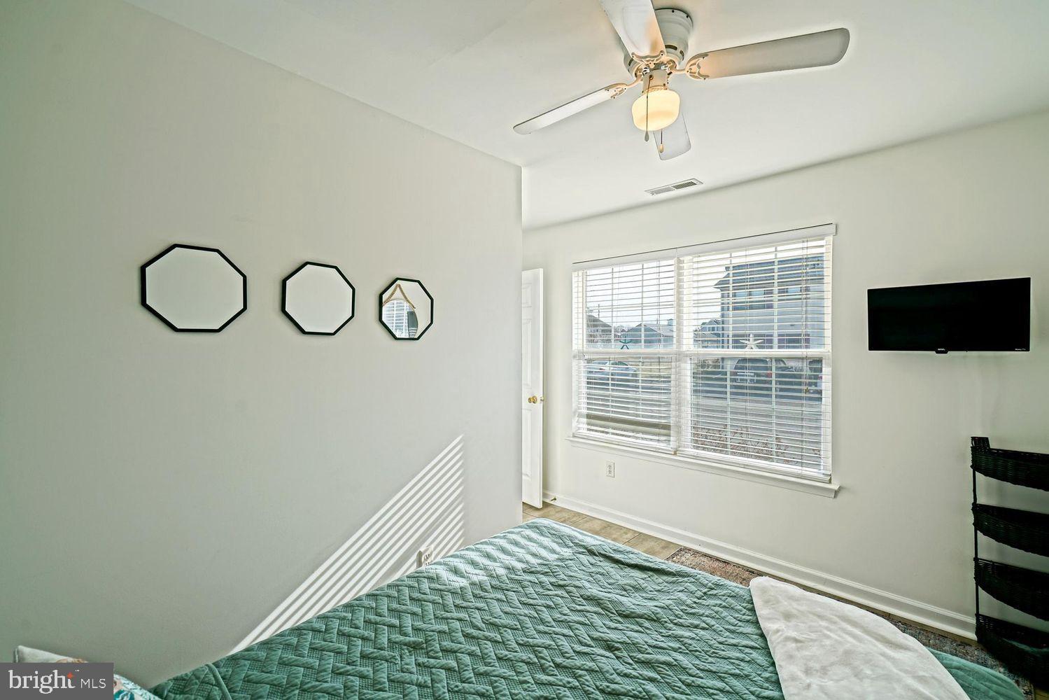 34531 Oakley Court, Unit 27 Lewes, DE 19958 - Photo 6 of 25 a view of a livingroom with wooden floor and a window