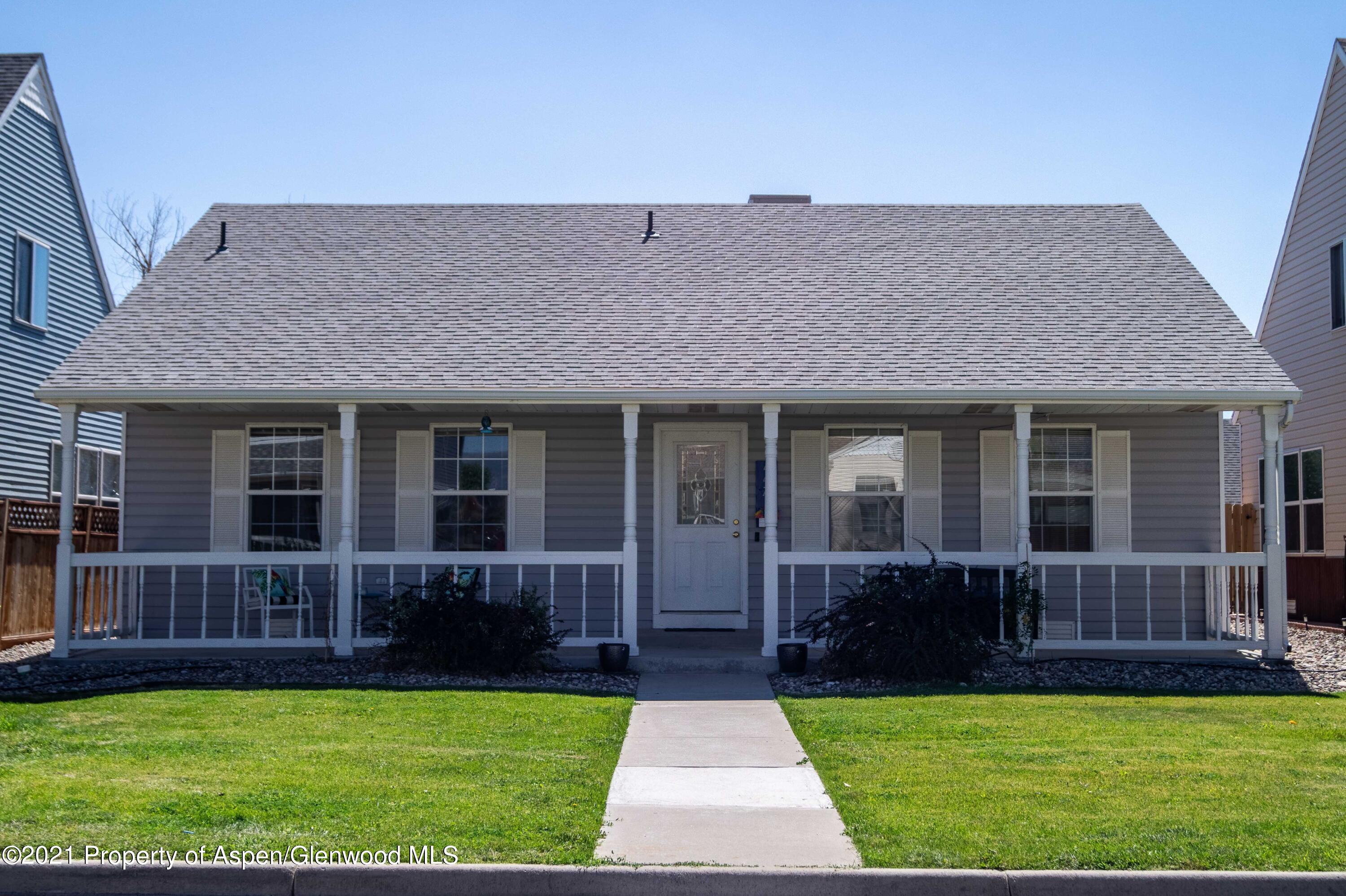 447 Columbine Drive Rifle, CO 81650 - Photo 1 of 36 a view of a house with garden and porch
