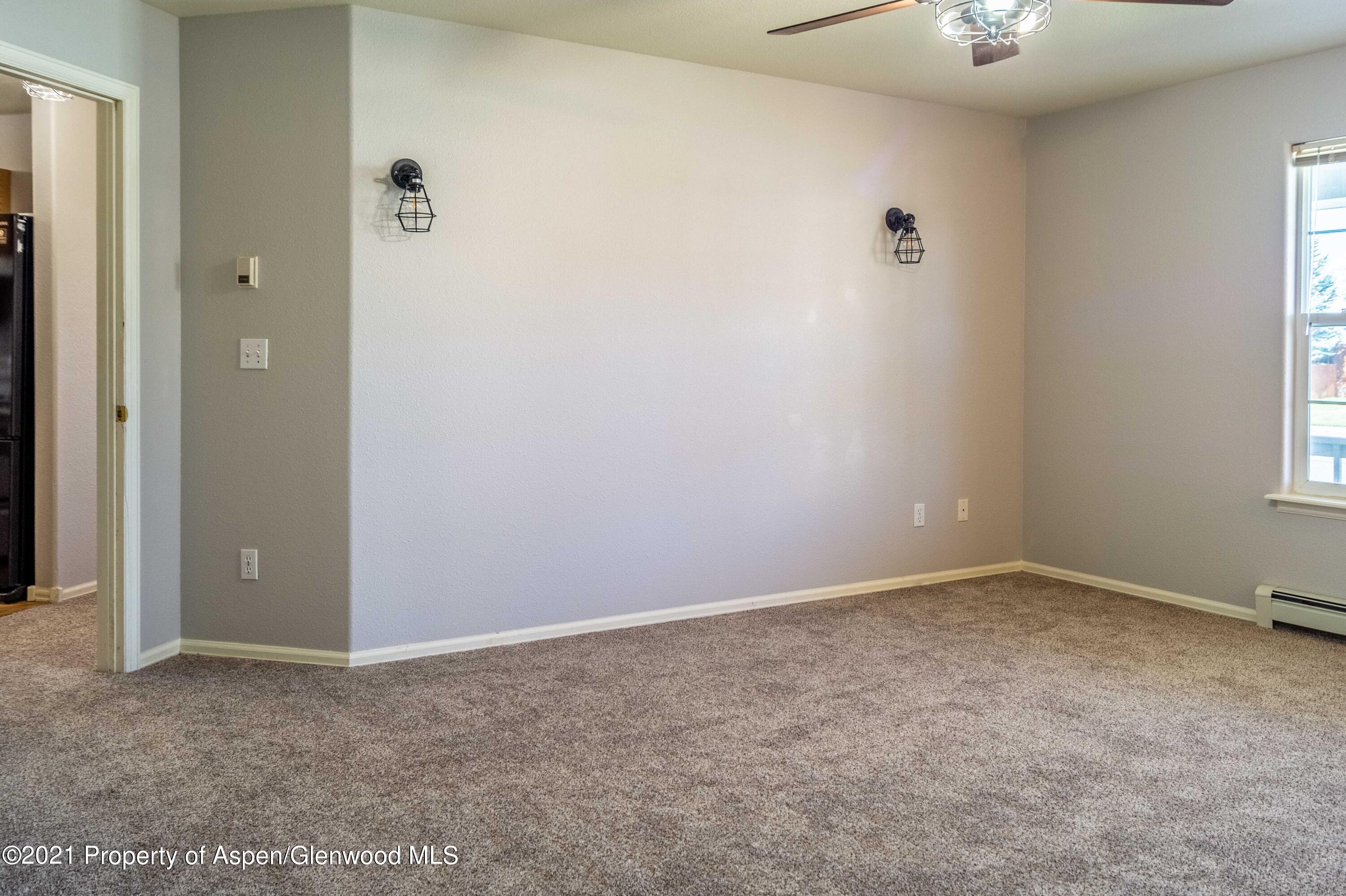 447 Columbine Drive Rifle, CO 81650 - Photo 20 of 36 an empty room with a window