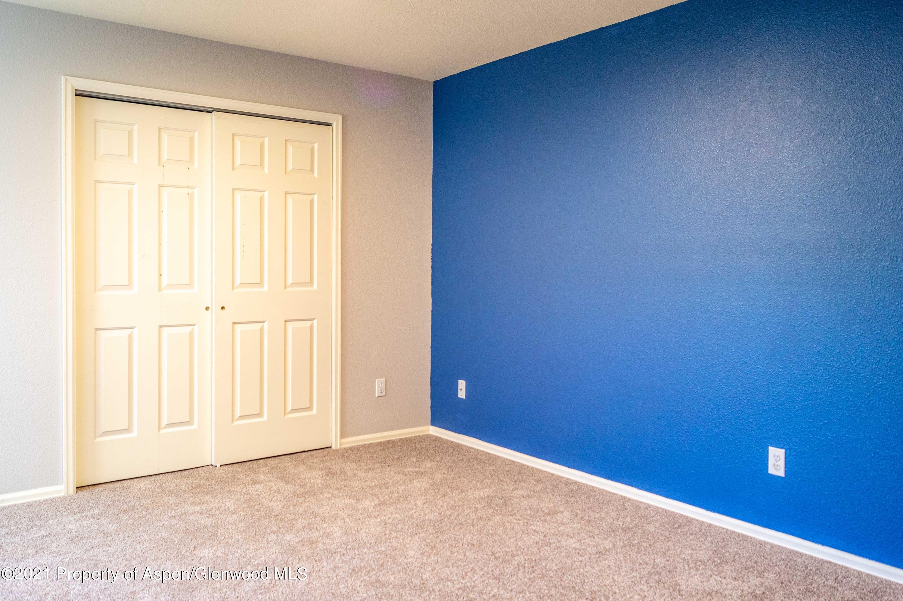 447 Columbine Drive Rifle, CO 81650 - Photo 26 of 36 an empty room with a empty space and a window