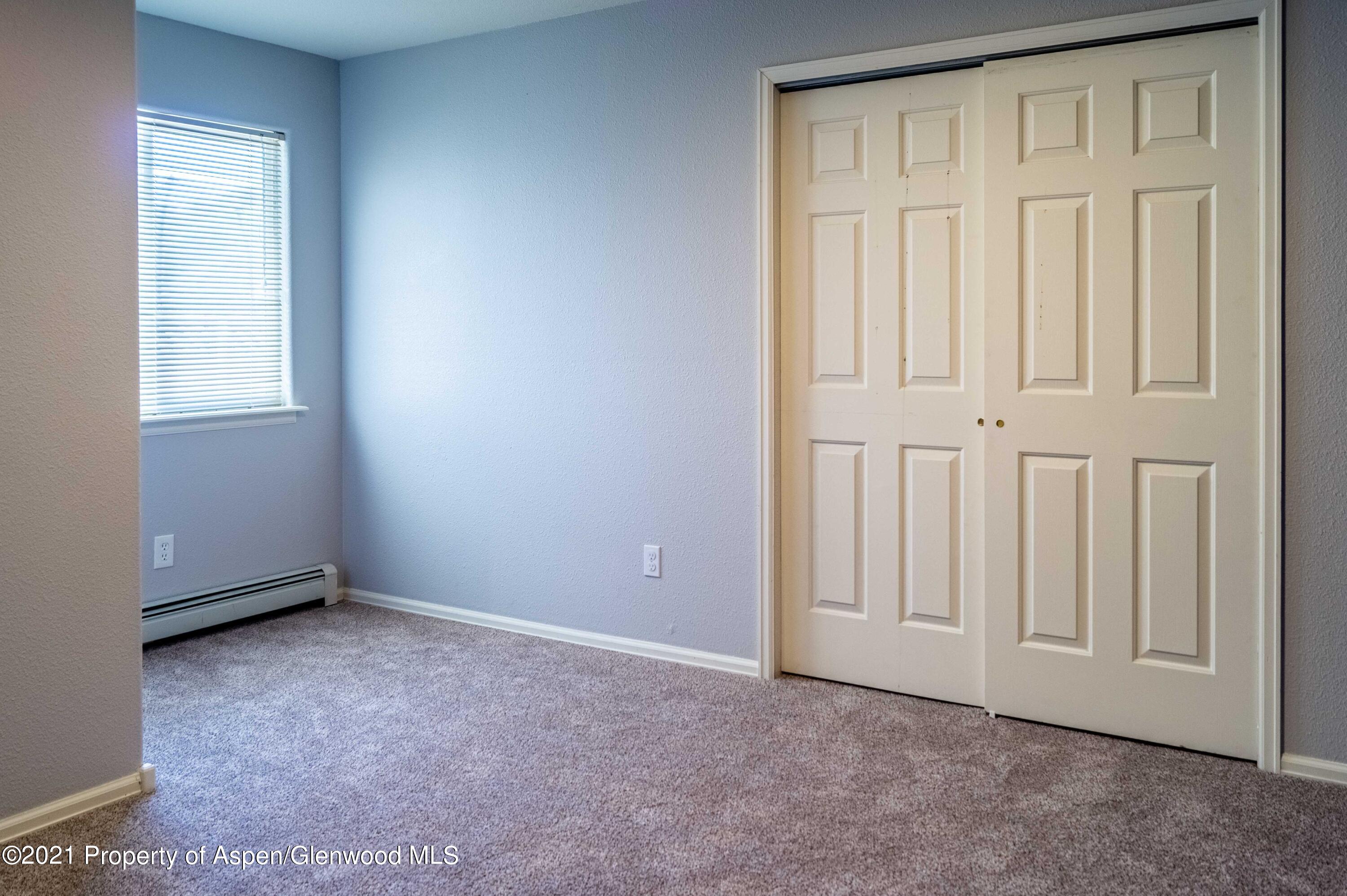 447 Columbine Drive Rifle, CO 81650 - Photo 27 of 36 an empty room with windows