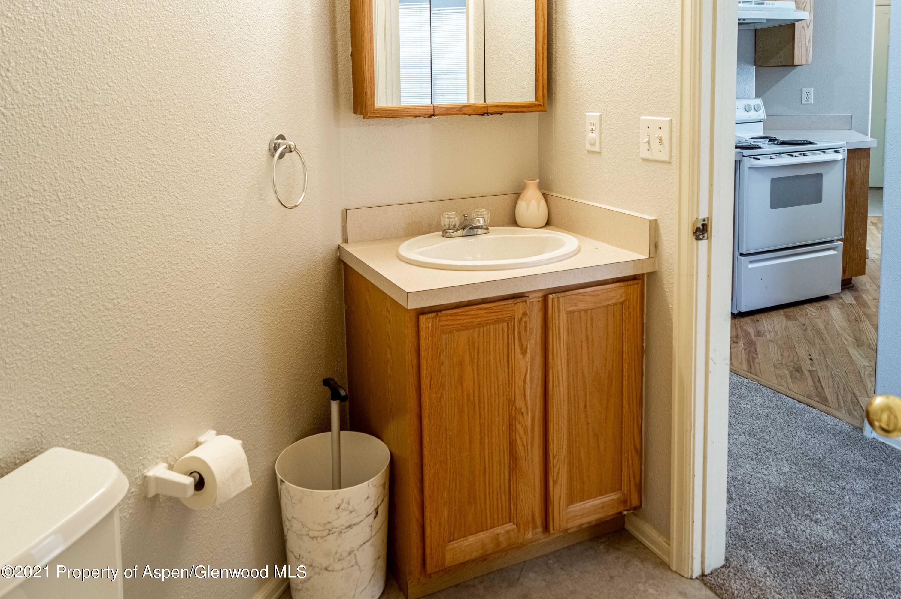 447 Columbine Drive Rifle, CO 81650 - Photo 30 of 36 a bathroom with a sink and a toilet