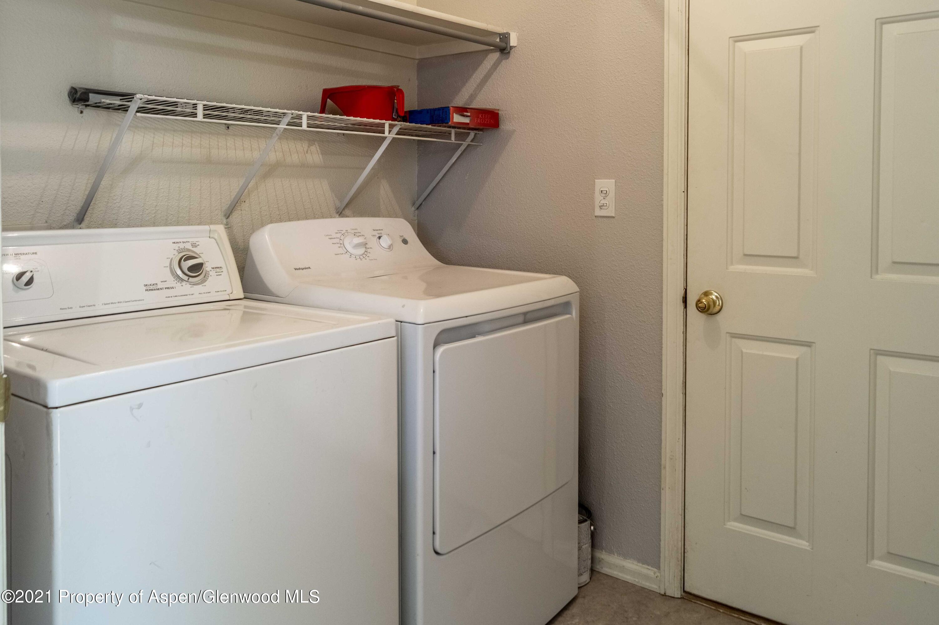 447 Columbine Drive Rifle, CO 81650 - Photo 31 of 36 a utility room with dryer and washer