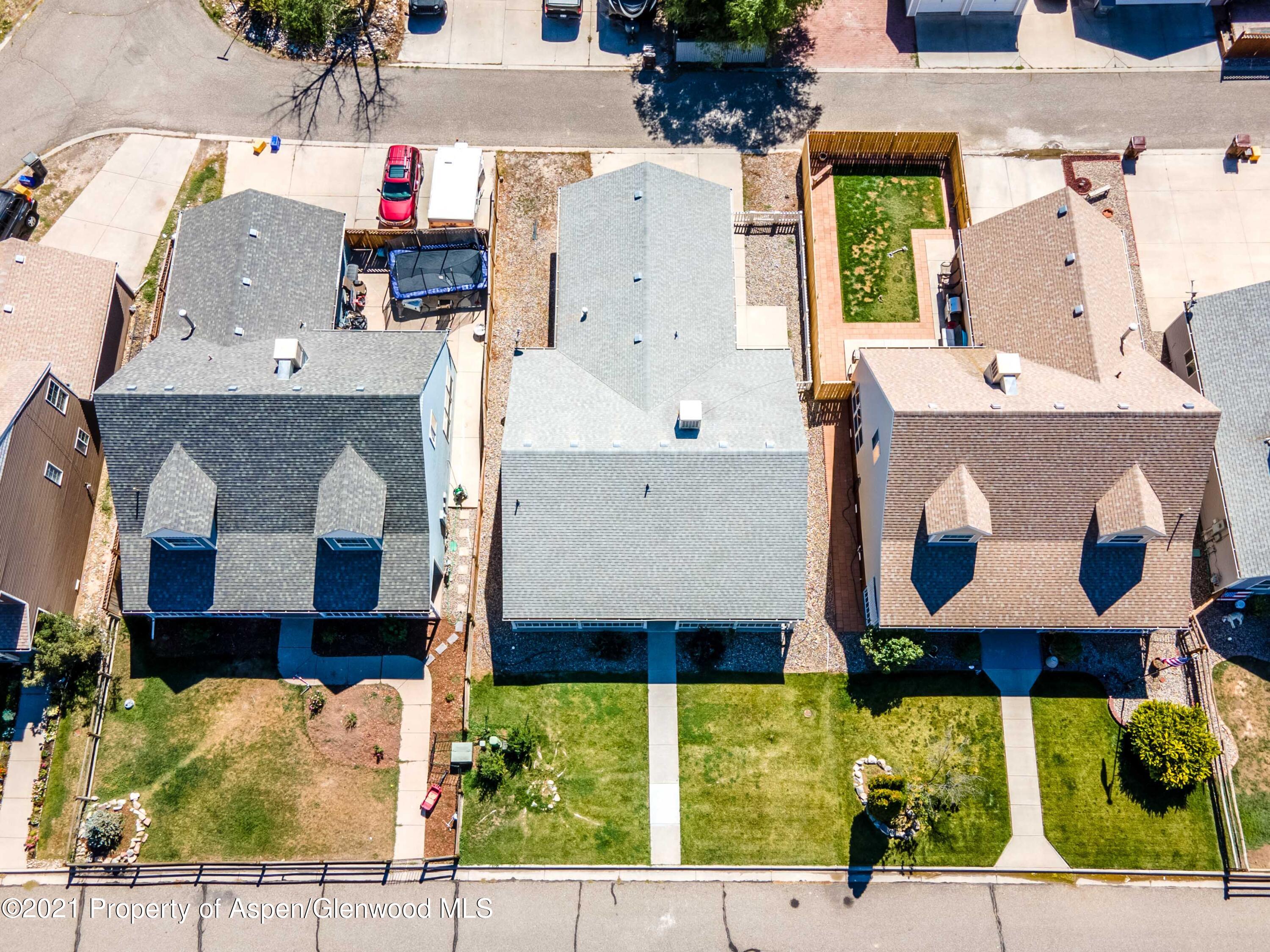 447 Columbine Drive Rifle, CO 81650 - Photo 33 of 36 an aerial view of residential houses with outdoor space and parking