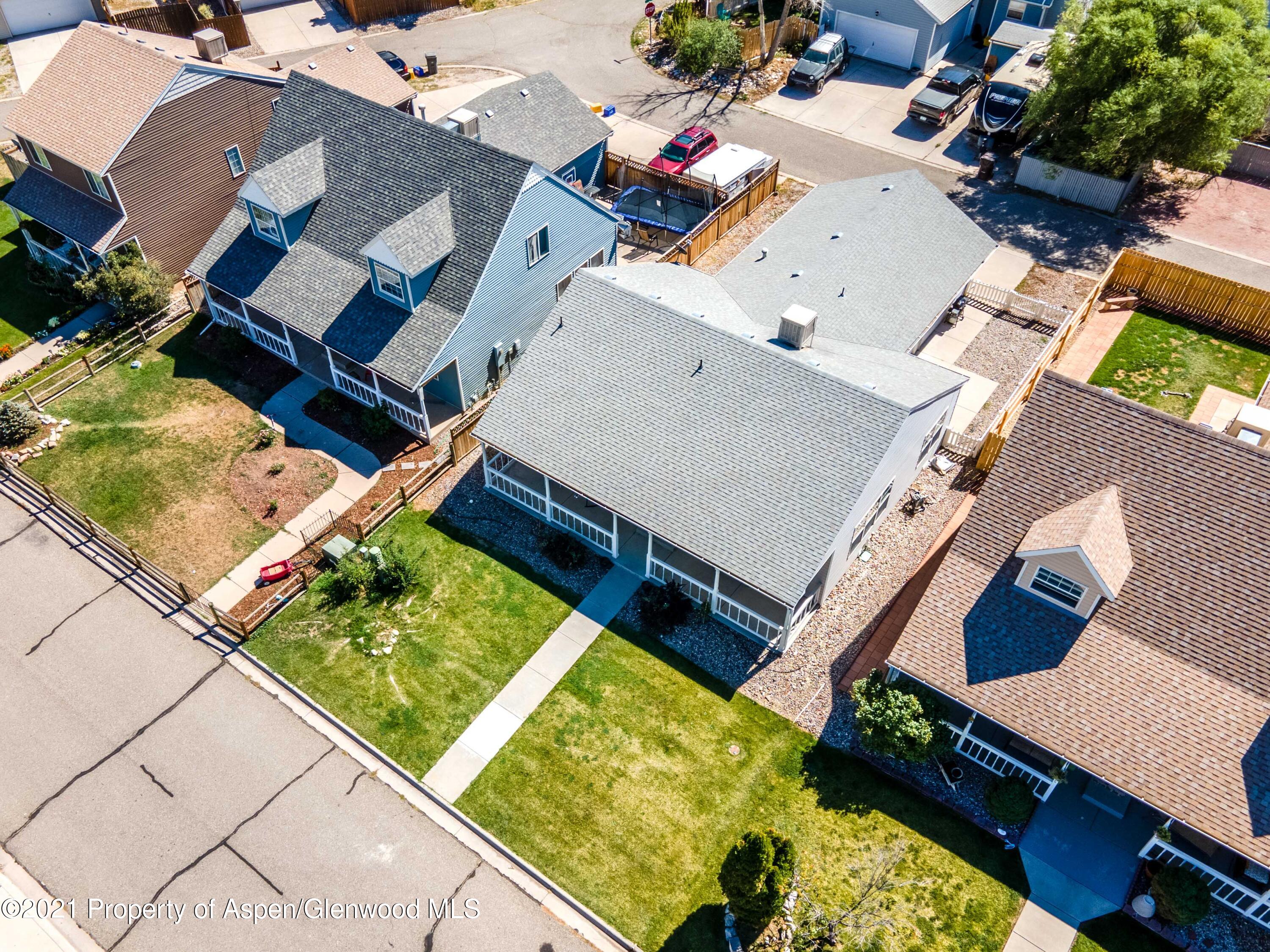 447 Columbine Drive Rifle, CO 81650 - Photo 34 of 36 an aerial view of a house with a garden and swimming pool