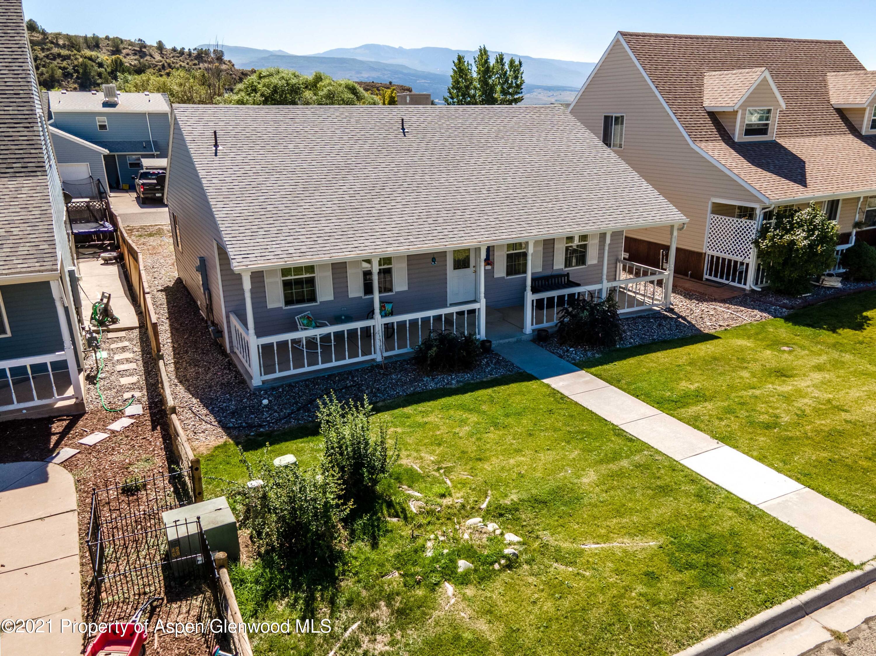 447 Columbine Drive Rifle, CO 81650 - Photo 4 of 36 an aerial view of a house with swimming pool garden and patio