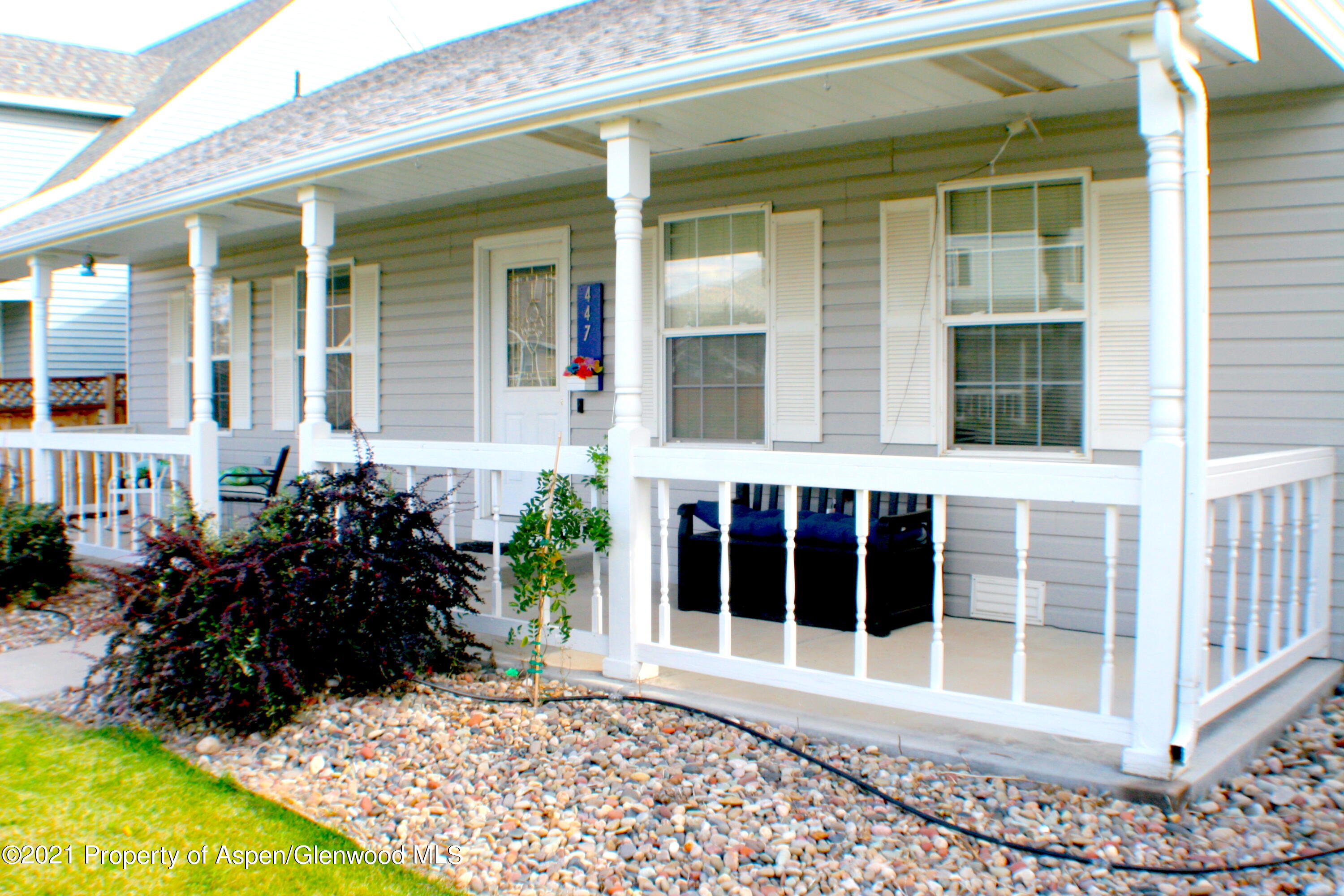 447 Columbine Drive Rifle, CO 81650 - Photo 7 of 36 a view of a entryway with a flower garden
