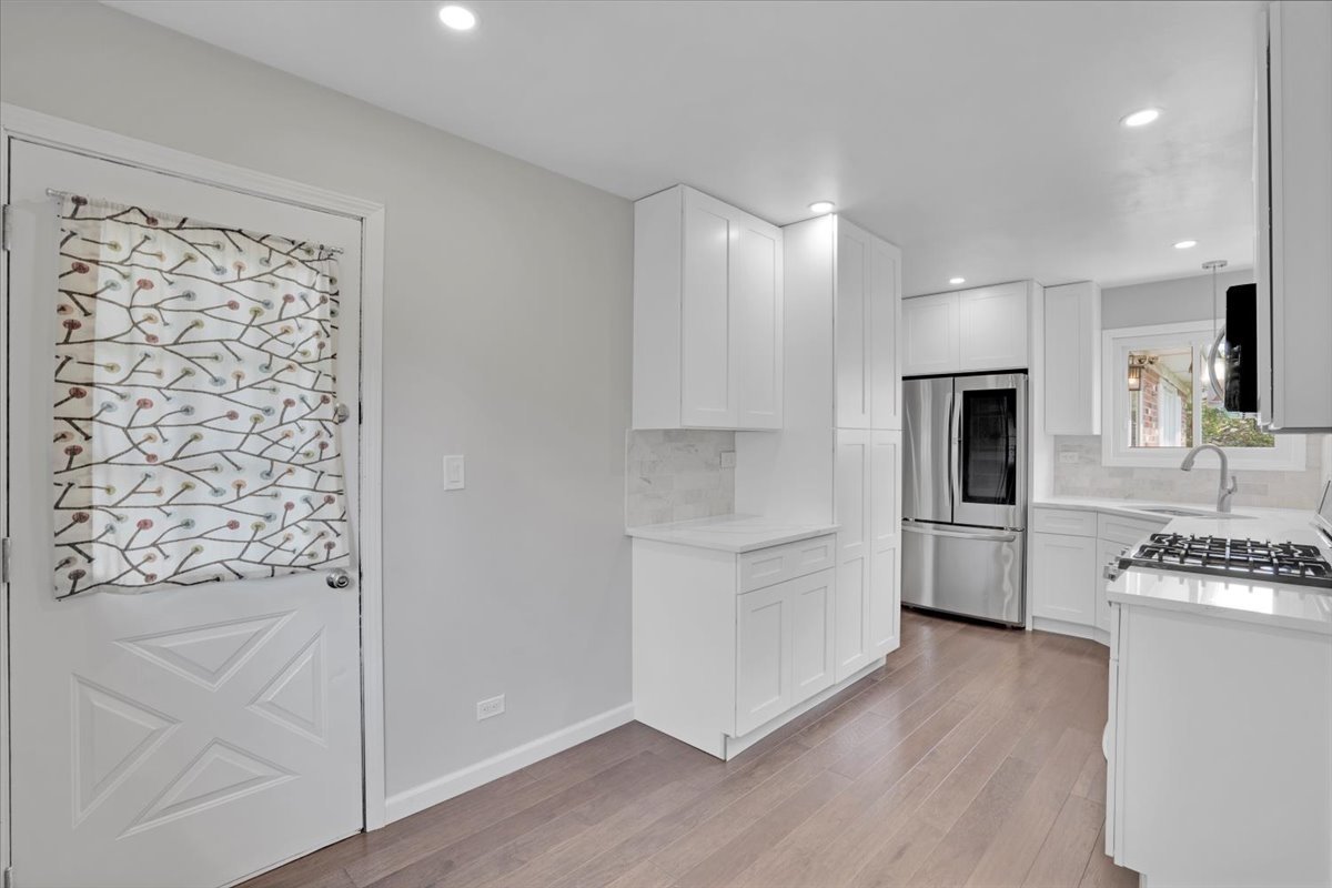 616 Rockhurst Road Bolingbrook, IL 60440 - Photo 13 of 37 a kitchen with stainless steel appliances a refrigerator sink and microwave
