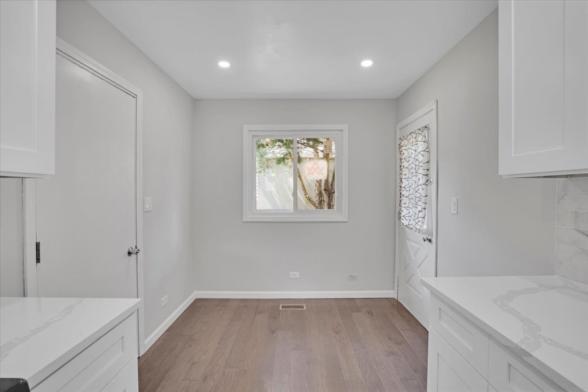 616 Rockhurst Road Bolingbrook, IL 60440 - Photo 15 of 37 wooden floor in an empty room with a window