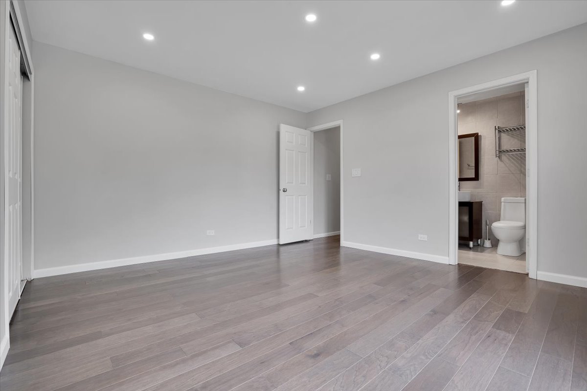 616 Rockhurst Road Bolingbrook, IL 60440 - Photo 18 of 37 a view of an empty room with wooden floor