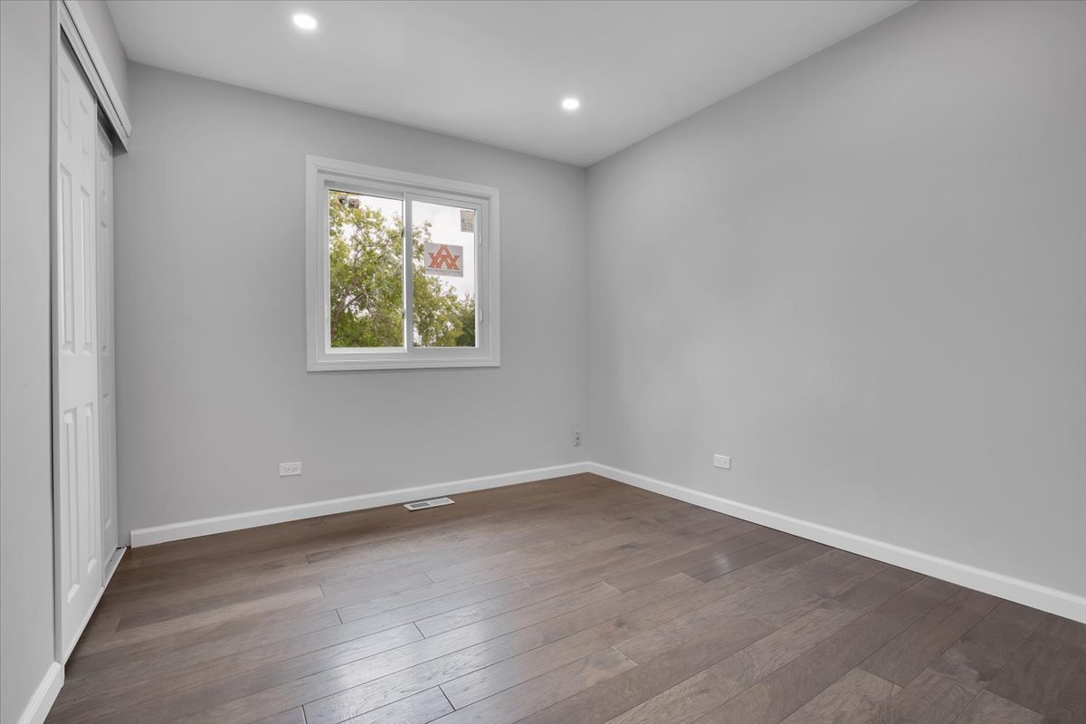 616 Rockhurst Road Bolingbrook, IL 60440 - Photo 21 of 37 wooden floor in an empty room with a window