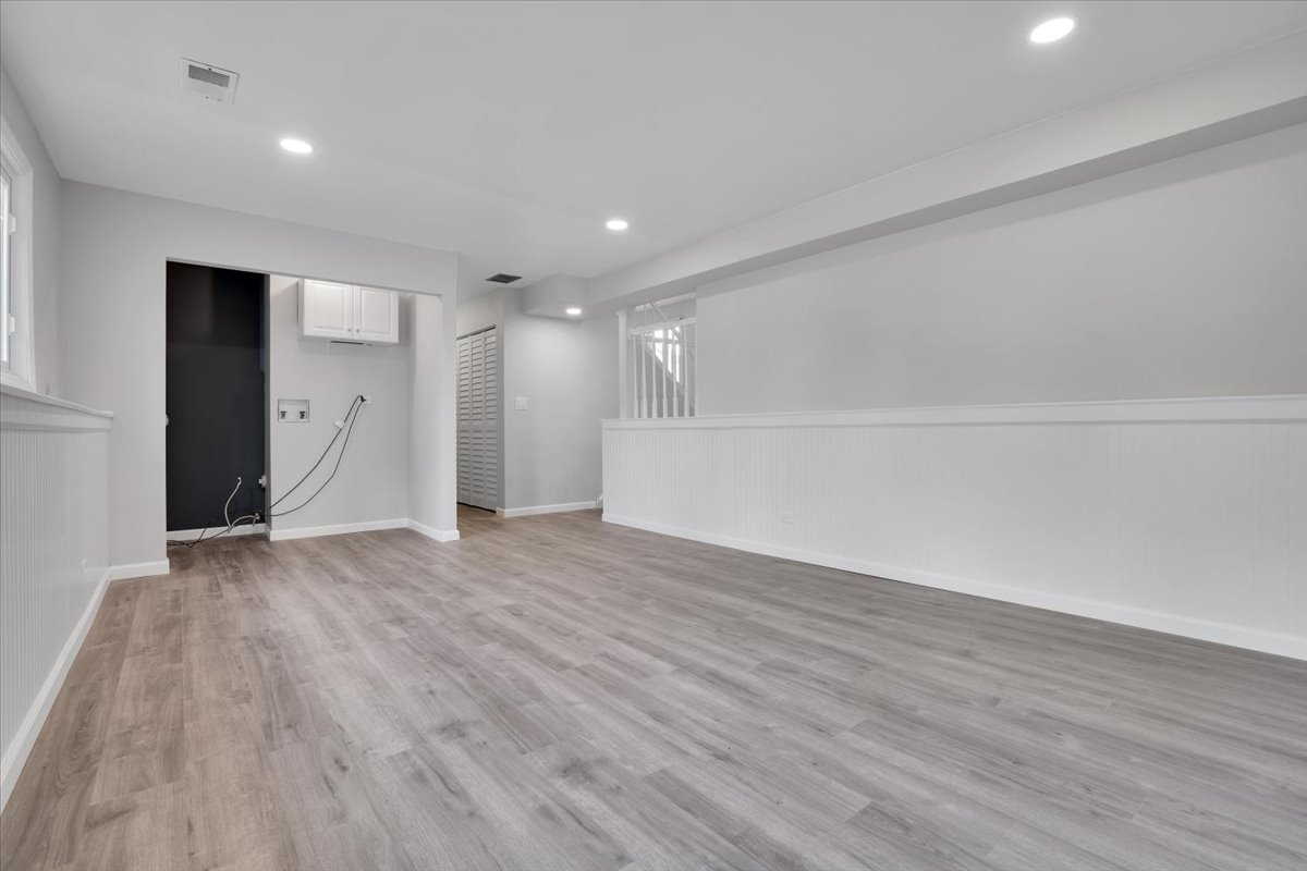 616 Rockhurst Road Bolingbrook, IL 60440 - Photo 26 of 37 a view of an empty room with wooden floor