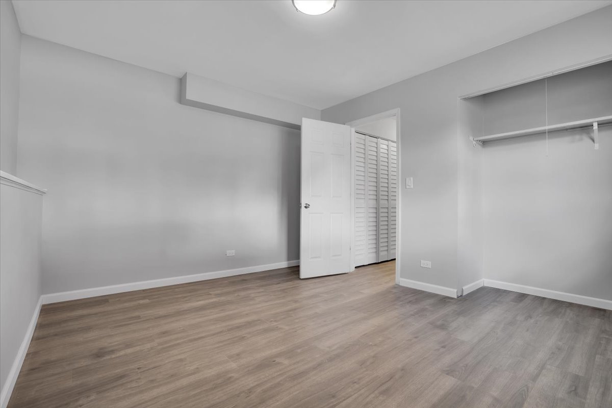 616 Rockhurst Road Bolingbrook, IL 60440 - Photo 29 of 37 a view of an empty room with wooden floor