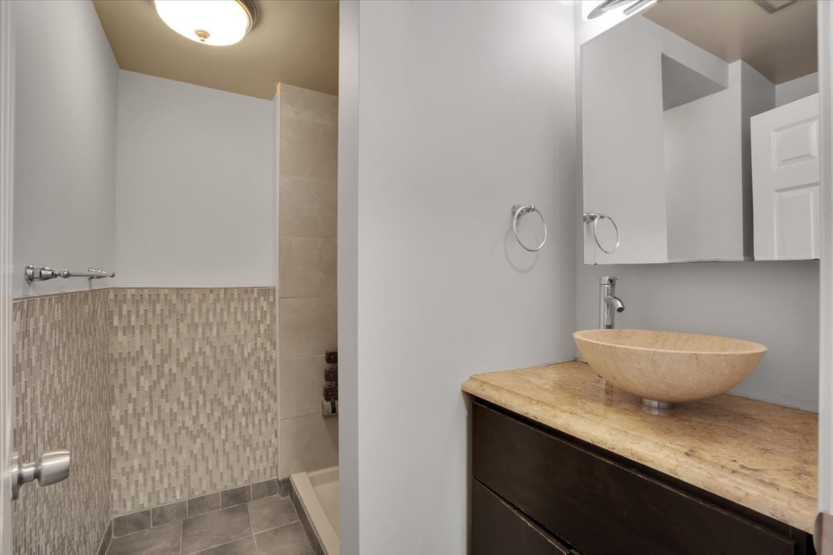 616 Rockhurst Road Bolingbrook, IL 60440 - Photo 30 of 37 a bathroom with a granite countertop sink and a toilet