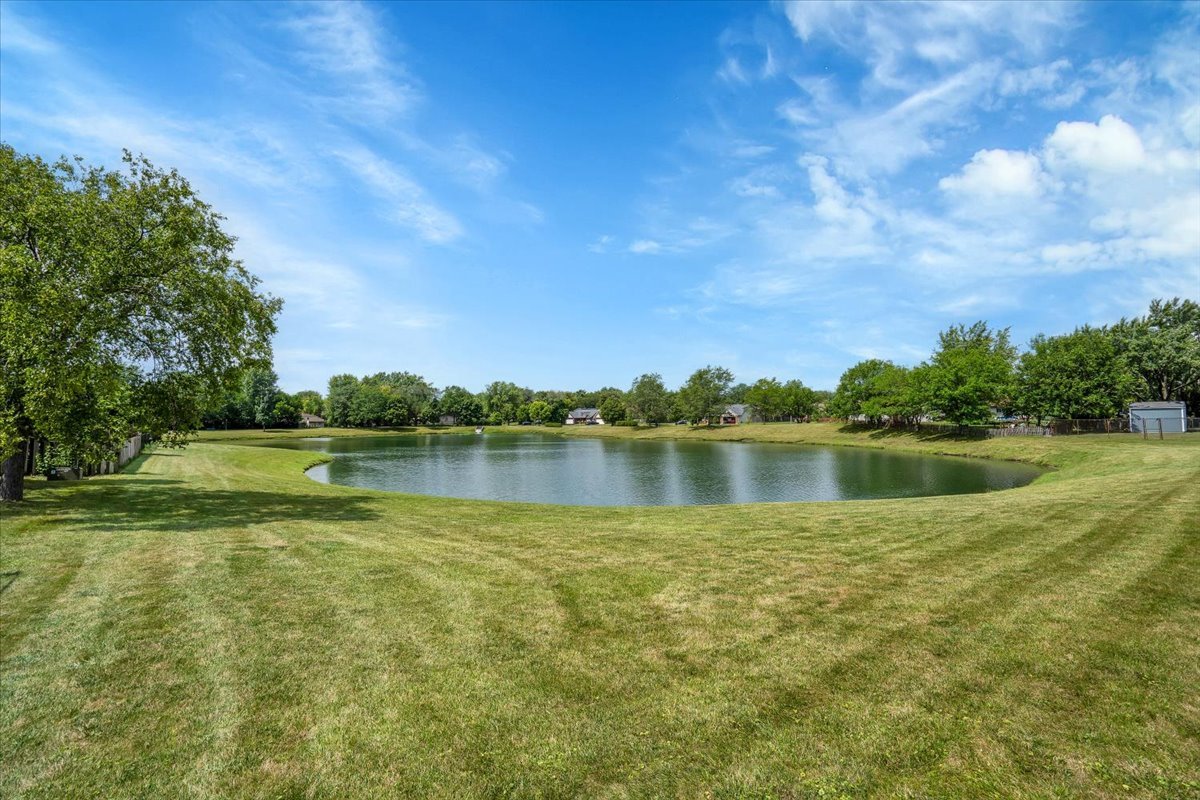 616 Rockhurst Road Bolingbrook, IL 60440 - Photo 37 of 37 a view of a lake with a yard