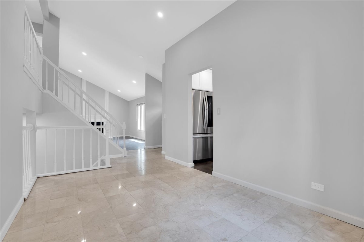 616 Rockhurst Road Bolingbrook, IL 60440 - Photo 9 of 37 a view of a hallway with staircase