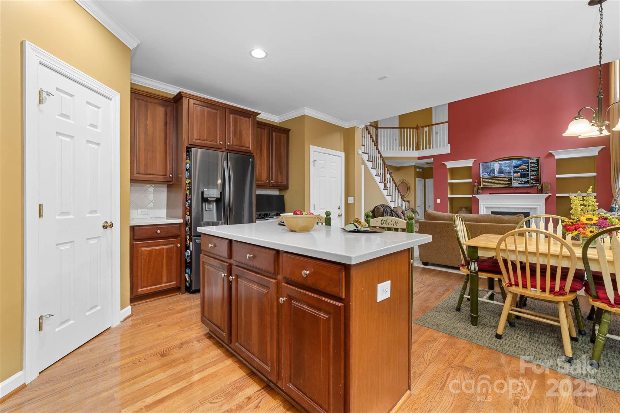 1728 Copperplate Road Charlotte, NC 28262 - Photo 15 of 36 a kitchen with stainless steel appliances a stove a sink refrigerator and a dining table with wooden floor