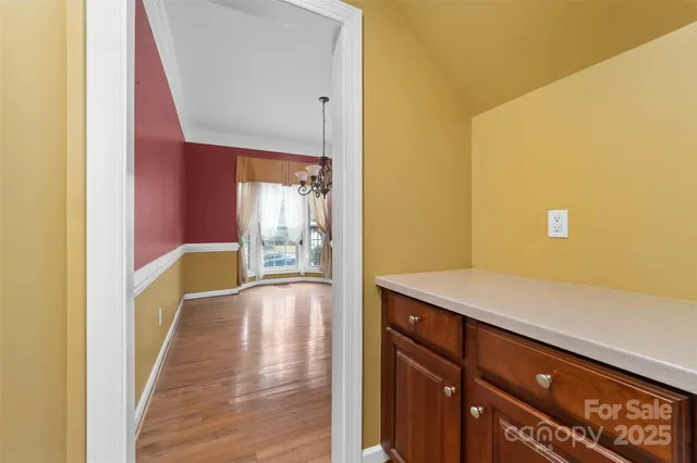 a hallway with wooden floor