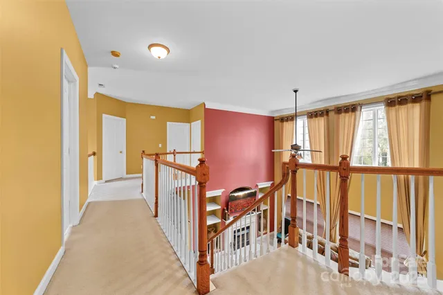 a view of a hallway with windows