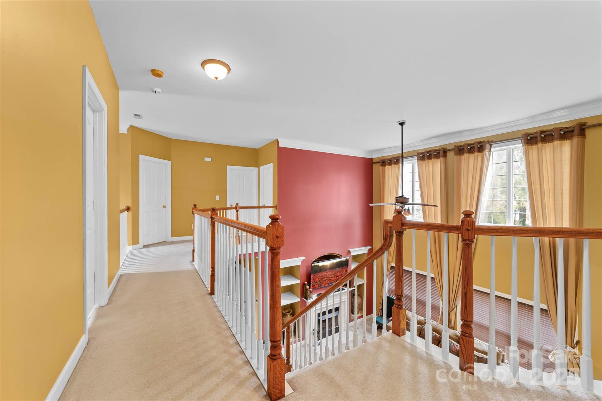 1728 Copperplate Road Charlotte, NC 28262 - Photo 18 of 36 a view of a hallway with windows