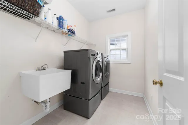a utility room with dryer and washer