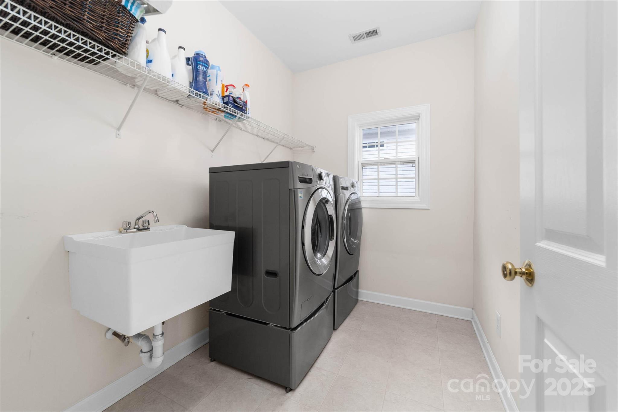 1728 Copperplate Road Charlotte, NC 28262 - Photo 21 of 36 a utility room with dryer and washer
