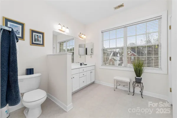 a room with furniture a bed and a window