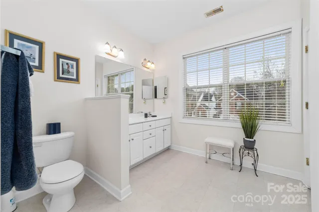 a room with furniture a bed and a window