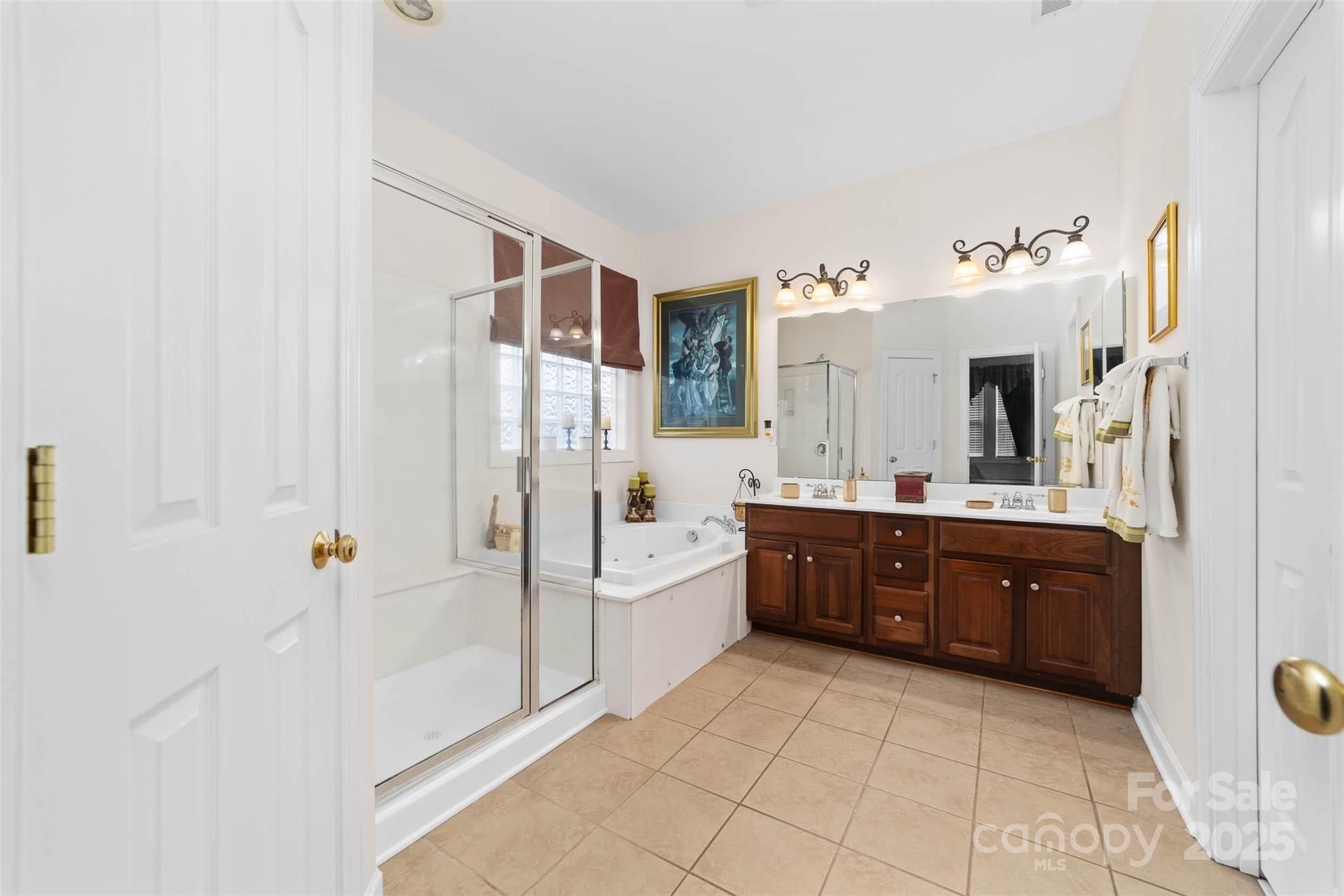 1728 Copperplate Road Charlotte, NC 28262 - Photo 29 of 36 a spacious bathroom with a tub sink and mirror