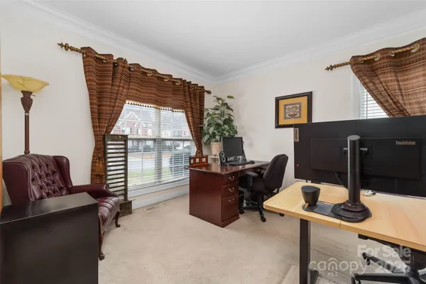a work room with furniture and a window