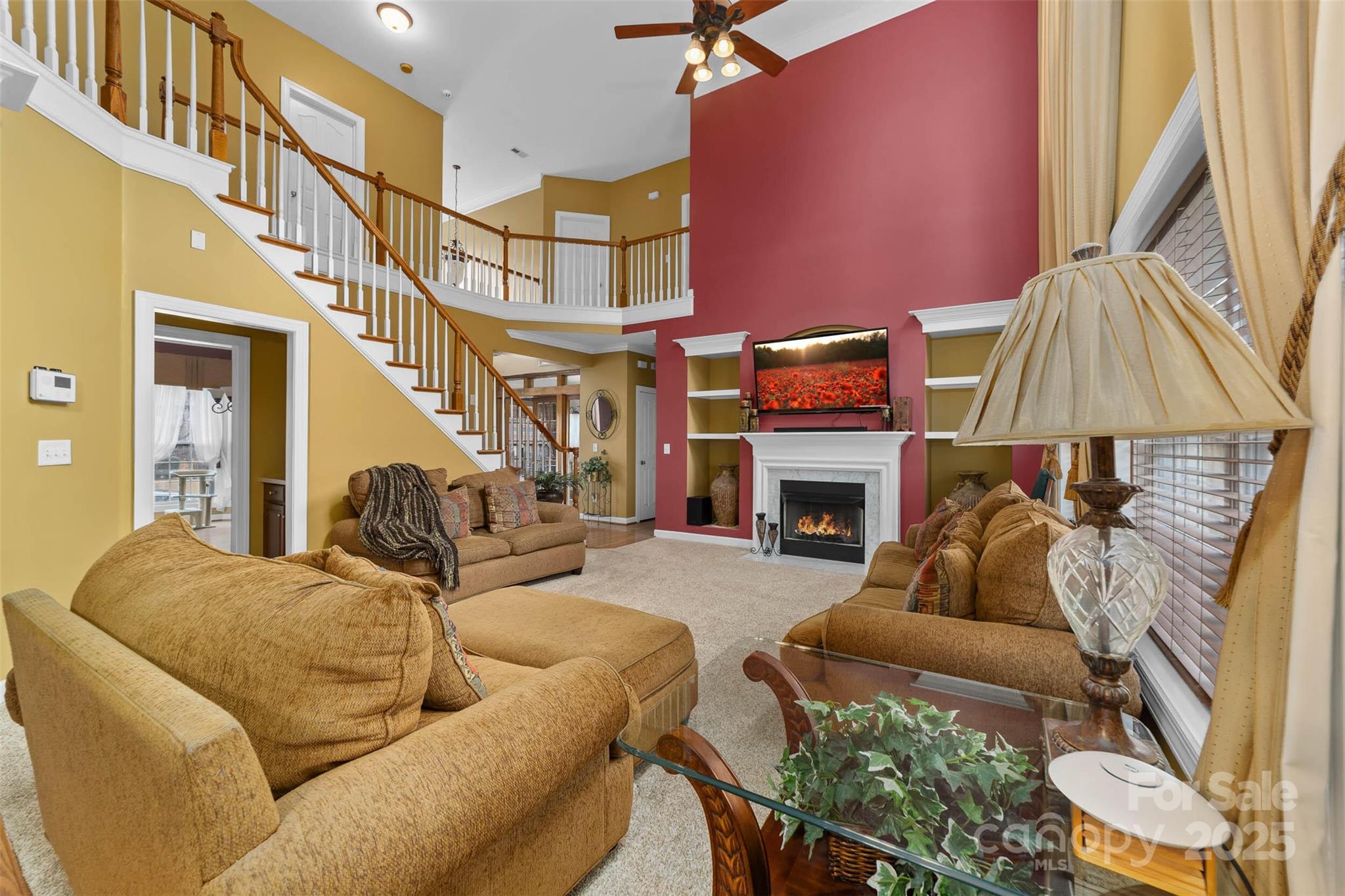1728 Copperplate Road Charlotte, NC 28262 - Photo 9 of 36 a living room with furniture a fireplace and a flat screen tv