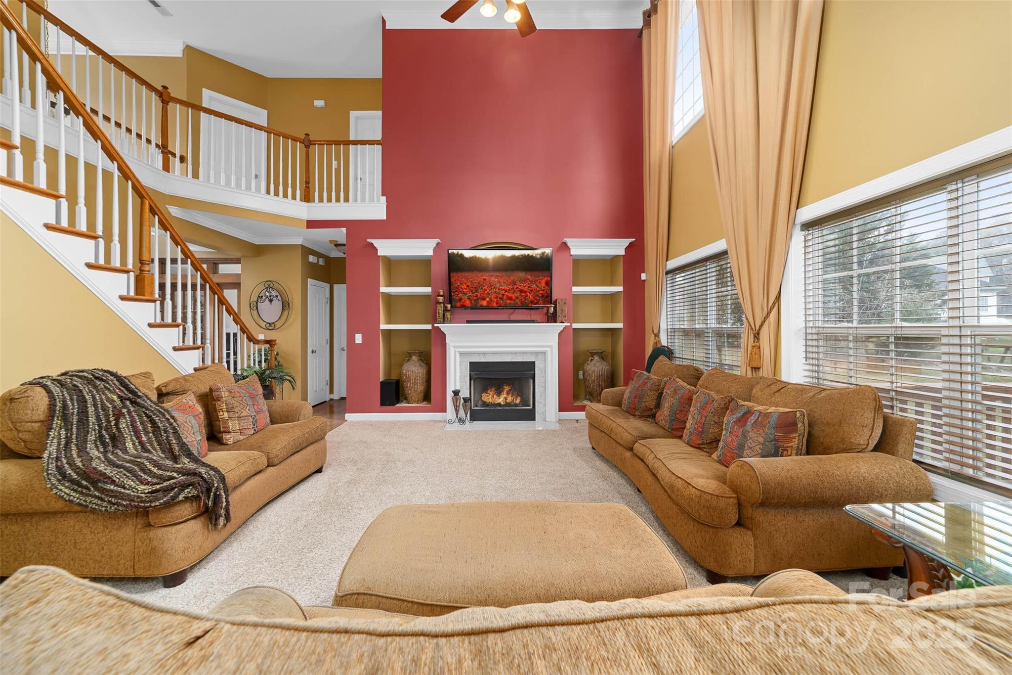 1728 Copperplate Road Charlotte, NC 28262 - Photo 10 of 36 a living room with furniture a fireplace and a large window