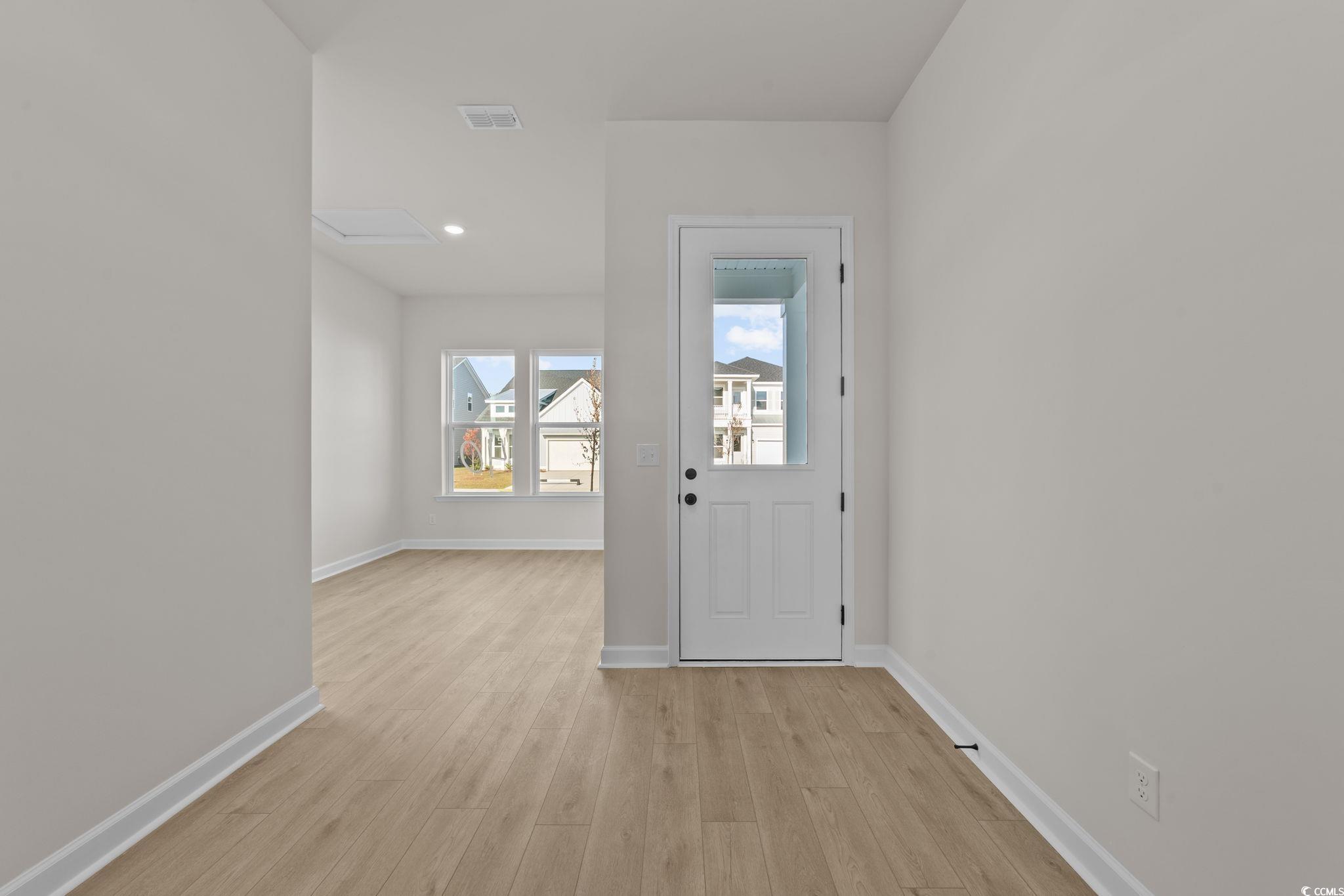 774 Ebb Tide Road Little River, SC 29566 - Photo 13 of 39 Corridor with recessed lighting and light wood-style floors