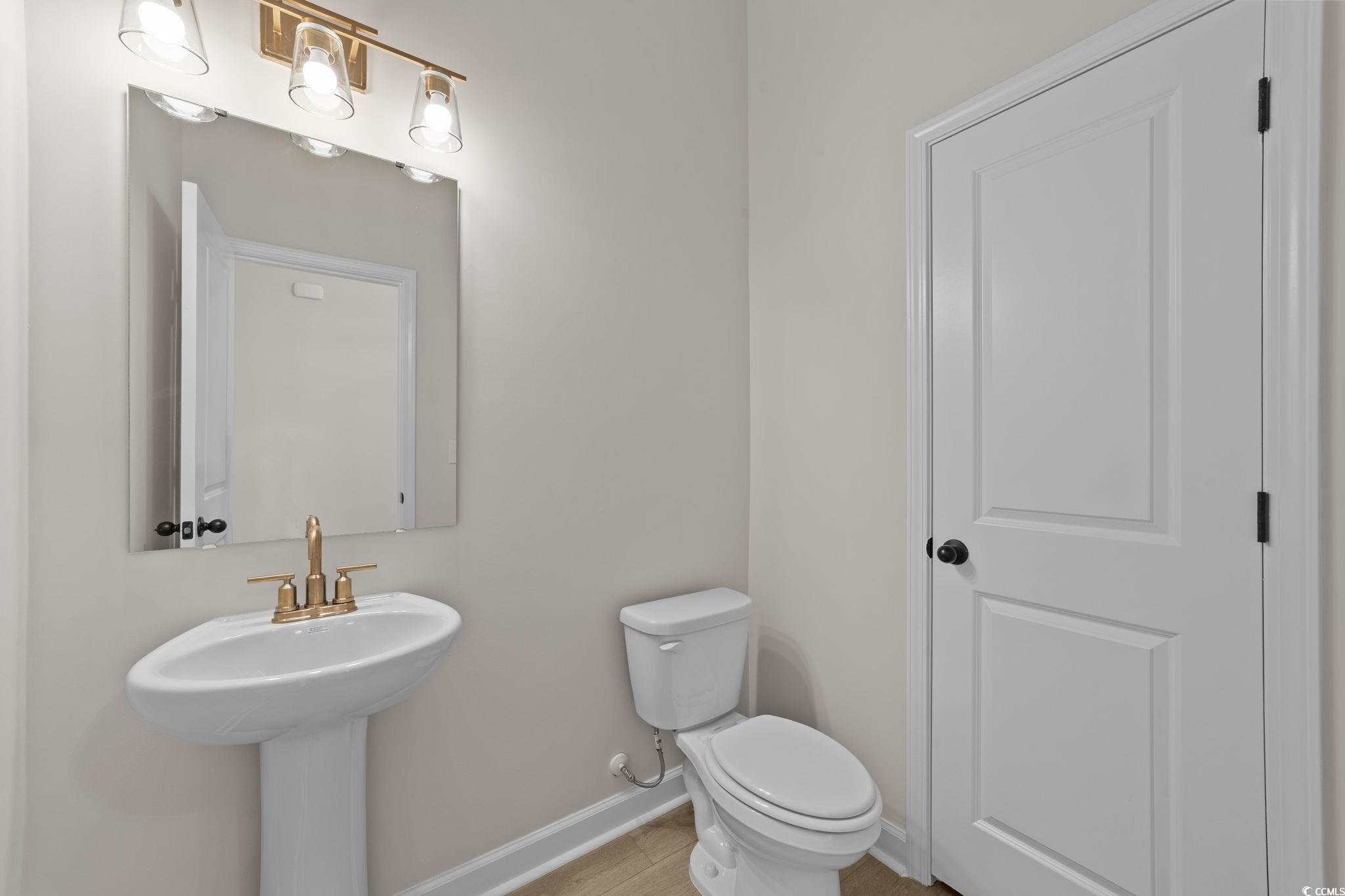 774 Ebb Tide Road Little River, SC 29566 - Photo 15 of 39 Spare room featuring light wood-style flooring and attic access