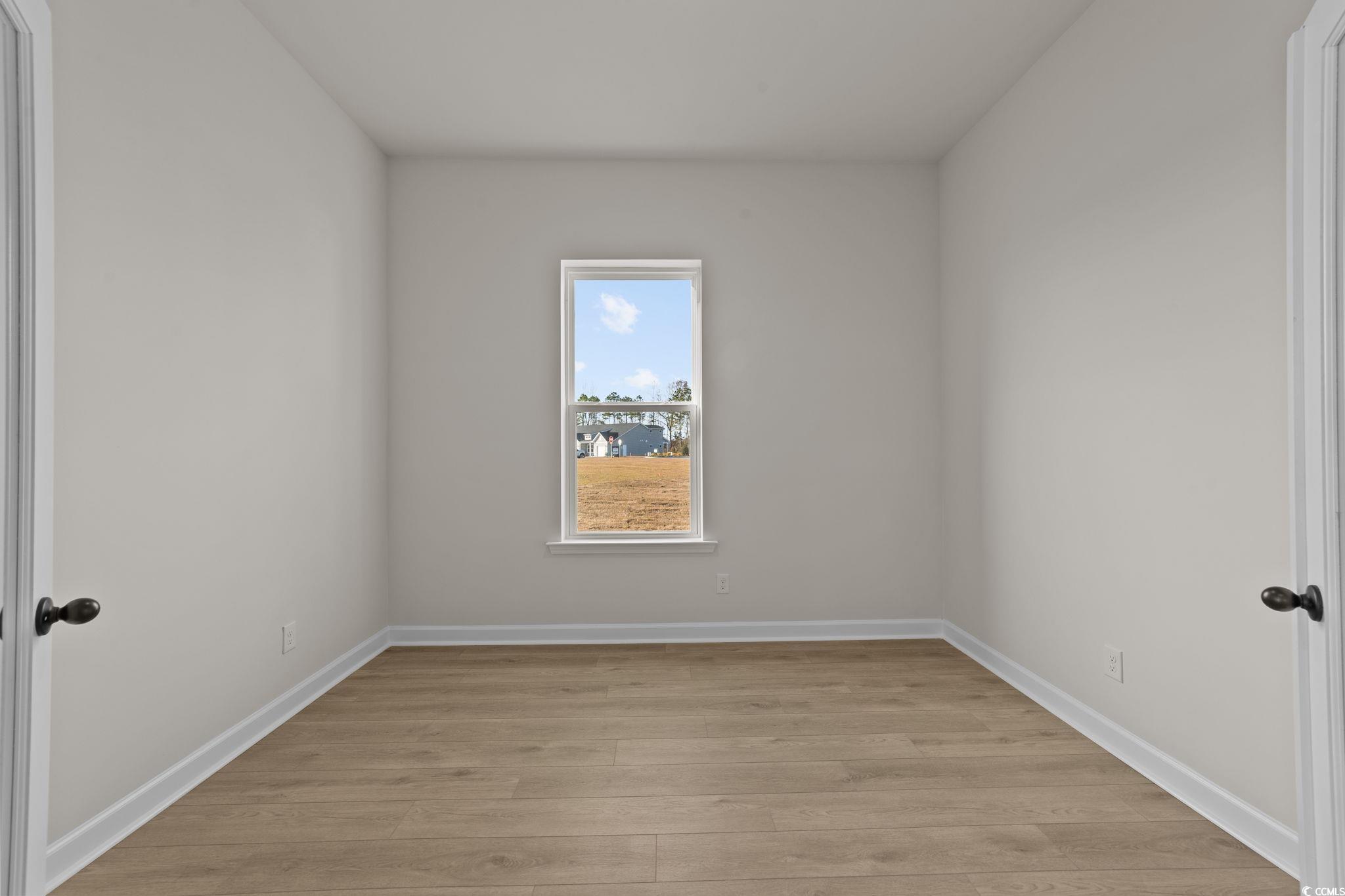 774 Ebb Tide Road Little River, SC 29566 - Photo 16 of 39 Half bathroom with baseboards and toilet