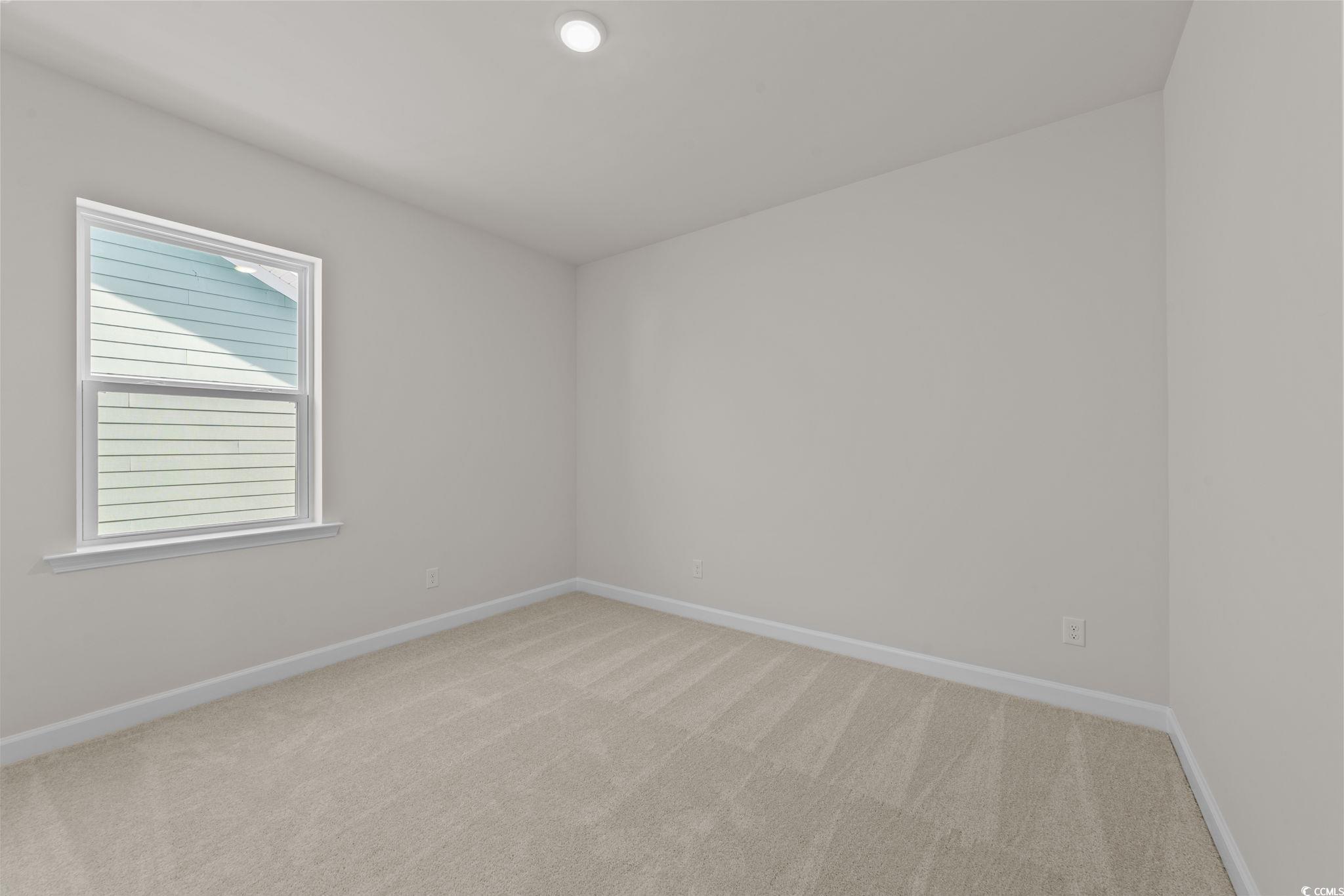 774 Ebb Tide Road Little River, SC 29566 - Photo 34 of 39 Spare room featuring light colored carpet and baseboards