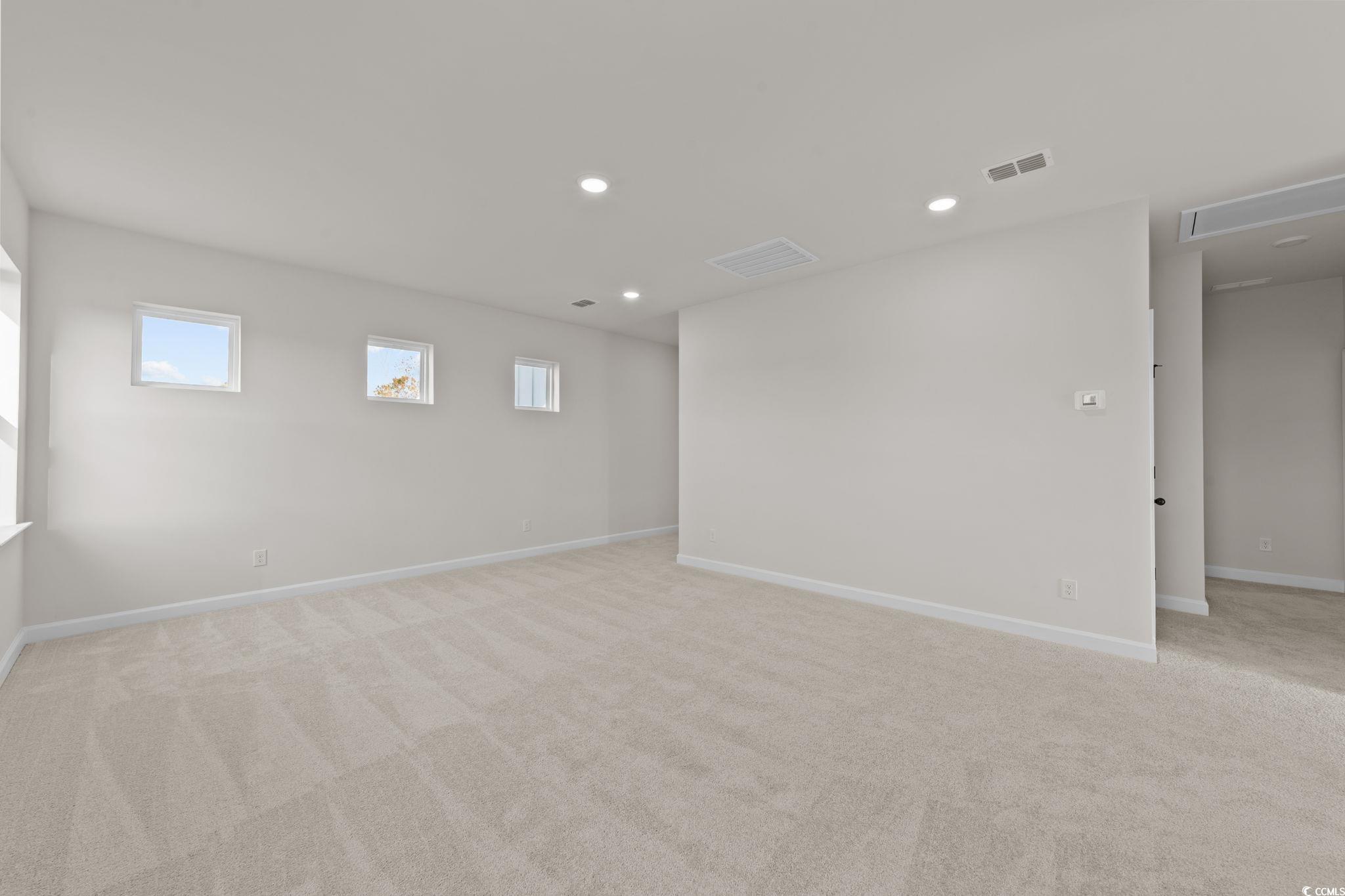 774 Ebb Tide Road Little River, SC 29566 - Photo 39 of 39 Doorway to outside featuring wood finished floors and baseboards