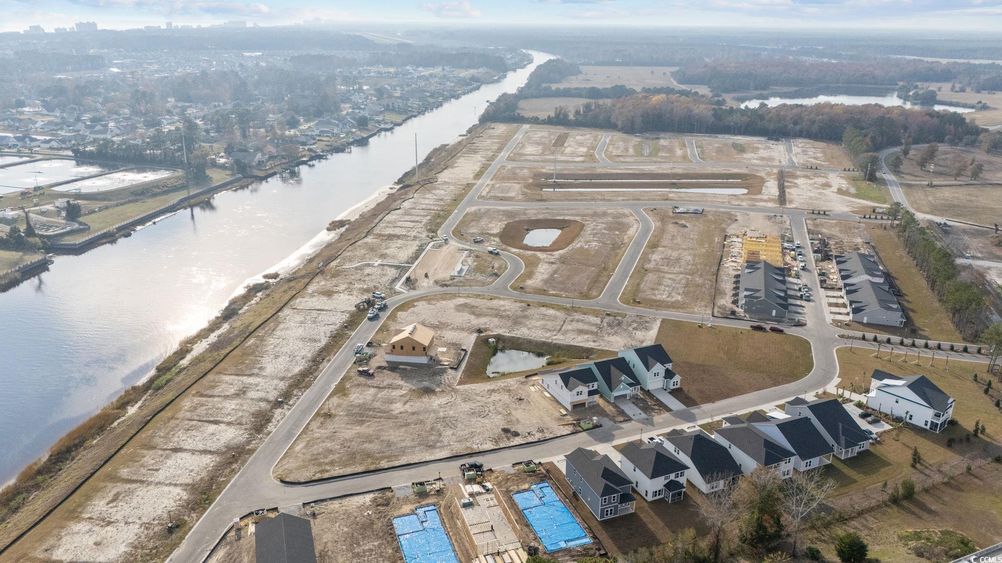 774 Ebb Tide Road Little River, SC 29566 - Photo 10 of 39 View of exterior entry with a patio area