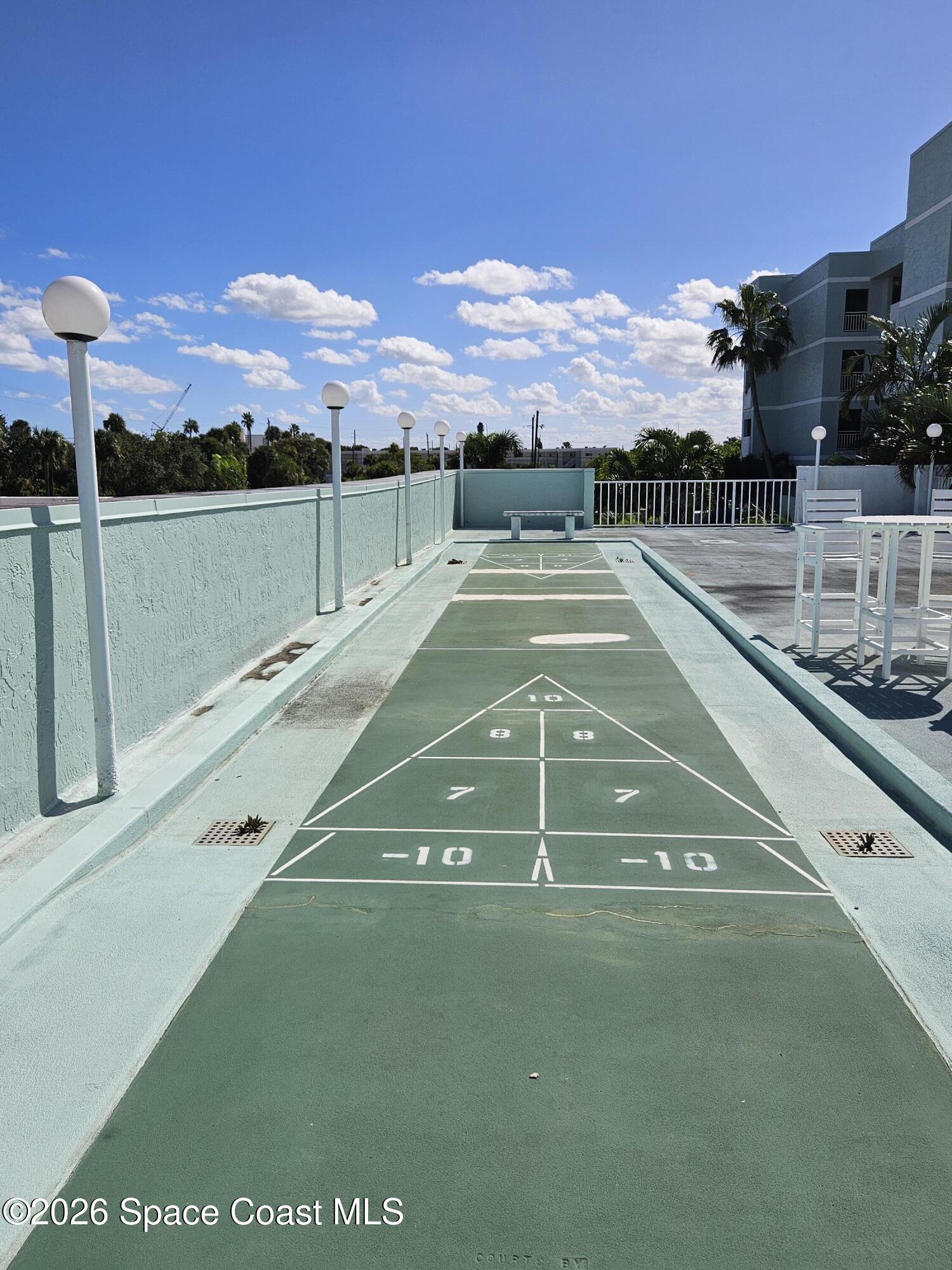 1750 Commodore Boulevard, Unit 2101 Cocoa Beach, FL 32931 - Photo 21 of 21 a view of a tennis court