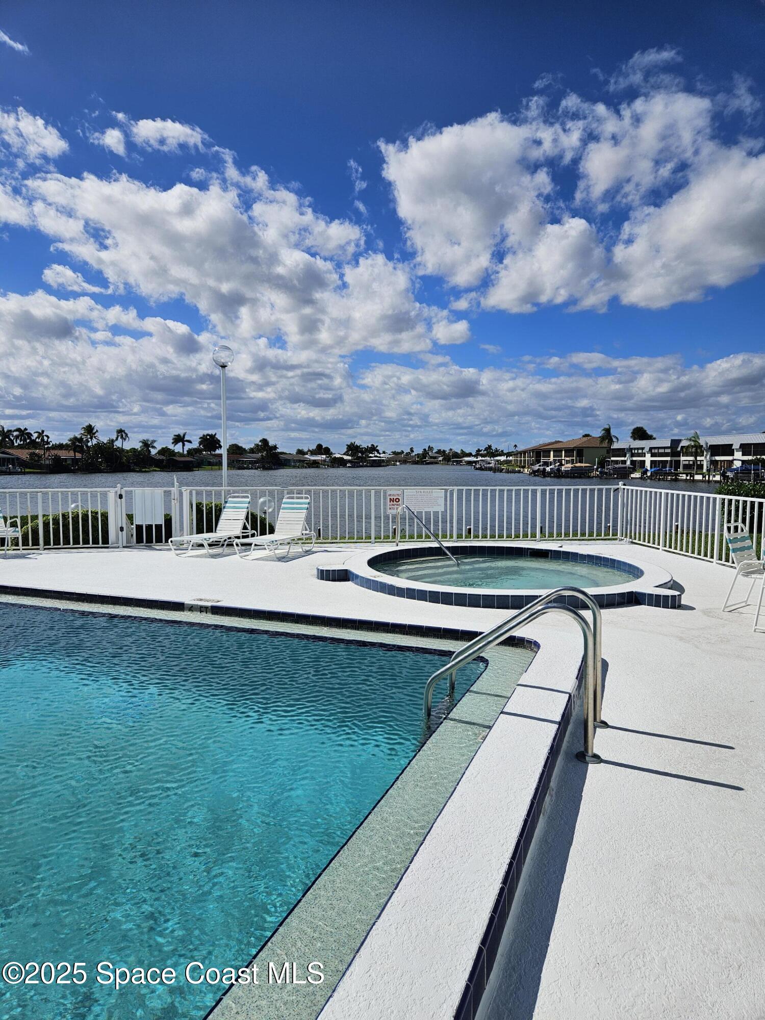 1750 Commodore Boulevard, Unit 2101 Cocoa Beach, FL 32931 - Photo 7 of 21 a view of swimming pool with seating area