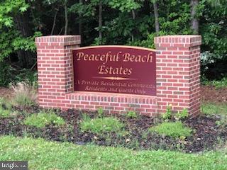 Lot 11 Peaceful Way Exmore, VA 23350 - Photo 5 of 21 a sign on the side of a building