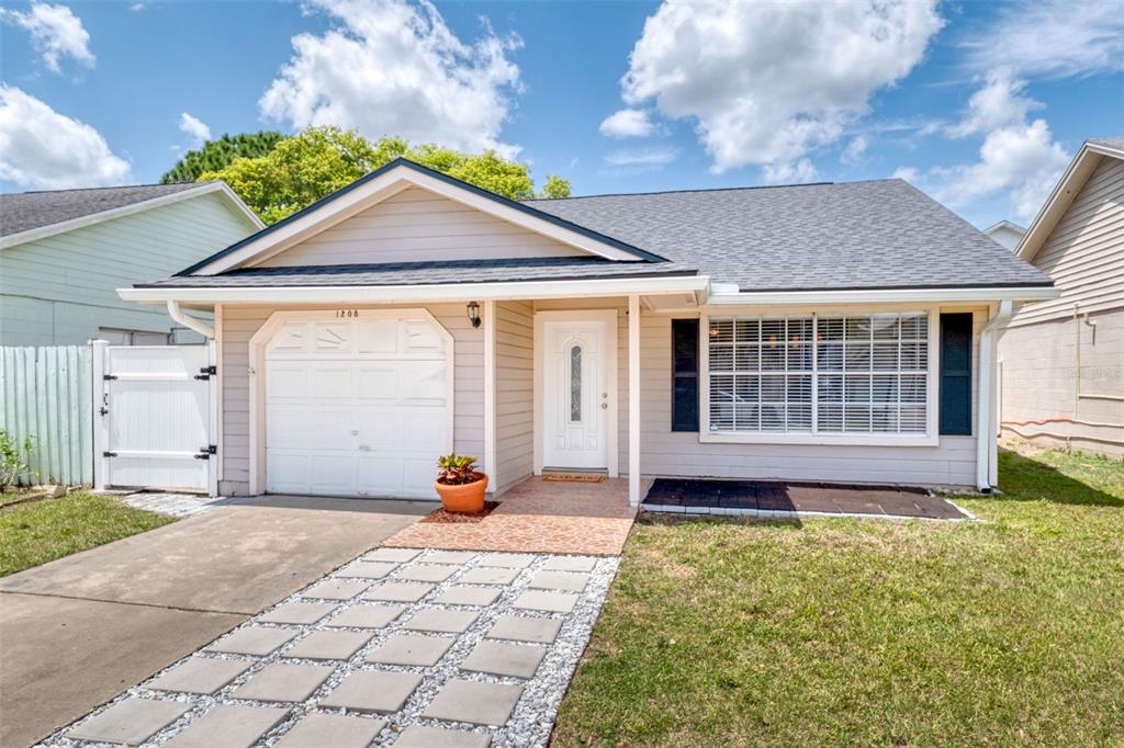 1208 Roma Court Orlando, FL 32825 - Photo 1 of 1 a front view of a house with a yard